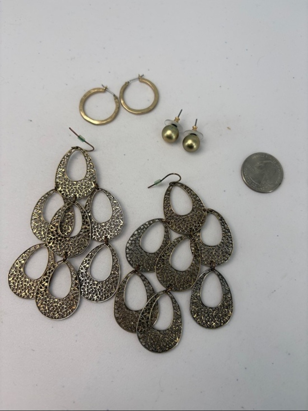 Three pair of preowned, gold tone, earrings, hoops chandelier posts